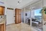 A large pantry with pullout drawers round out the kitchen cabinet tree. All very conveniently located with sliders to the front Terrace.