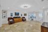 Bright and Cheerful - TV/Den Area - Travertine stone Floors and sharp modern lighting
