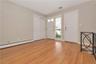 Entry Foyer, Door leads to two car garage, stairs lead to finished lower level