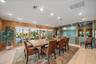 DINING ROOM with 2 full walls of windows that face Lemon Bay, CYPRESS walls, and your private dock, just a stone's throw - room for 10-12 seating easi