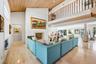 Living Room has elevated cedar ceilings