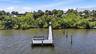 Enjoy watching the boats cruise along from your newer dock on the Bay