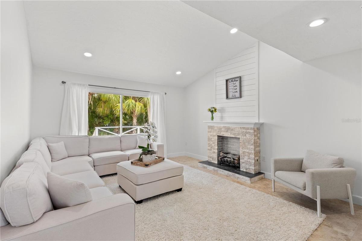 Open Living Room bathed in natural light and high ceilings