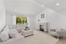Open Living Room bathed in natural light and high ceilings
