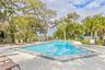 Tranquil pool setting with lake and grand oak views