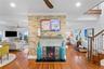 Double sided brick fireplace with tabby stucco.