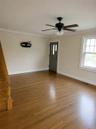 Main primary house. Dining / Living room, and main entry, with staircase up to finished attic
