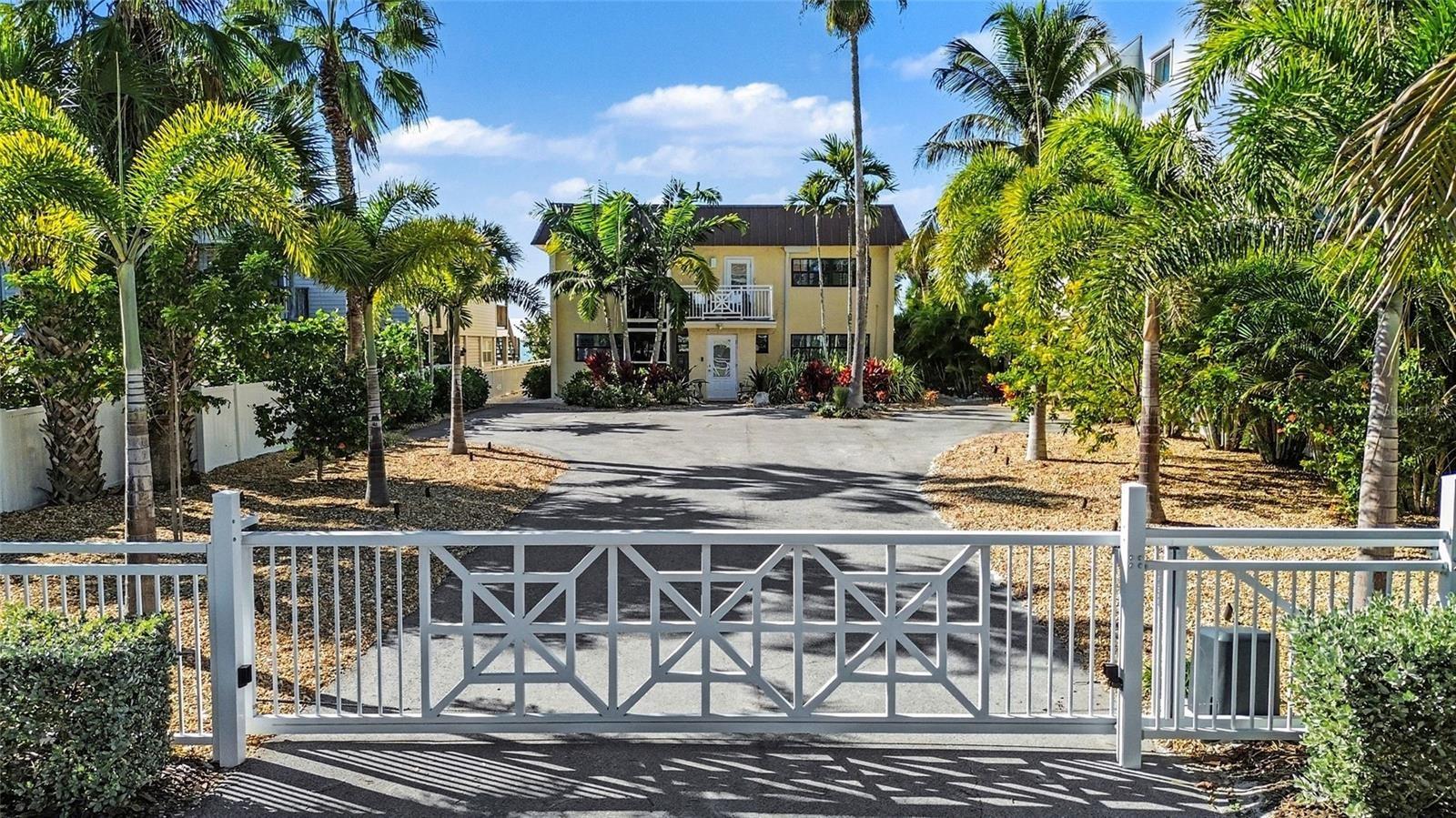 Enter your beachfront property through a custom remote gate, offering further privacy.