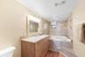 Primary bathroom with jetted tub, new cabinets, and countertop.