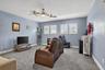 Expansive loft space ideal as a second living area, playroom, or in-home theatre.