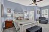 Oversized primary on the first floor with ensuite bath and door leading to lanai.