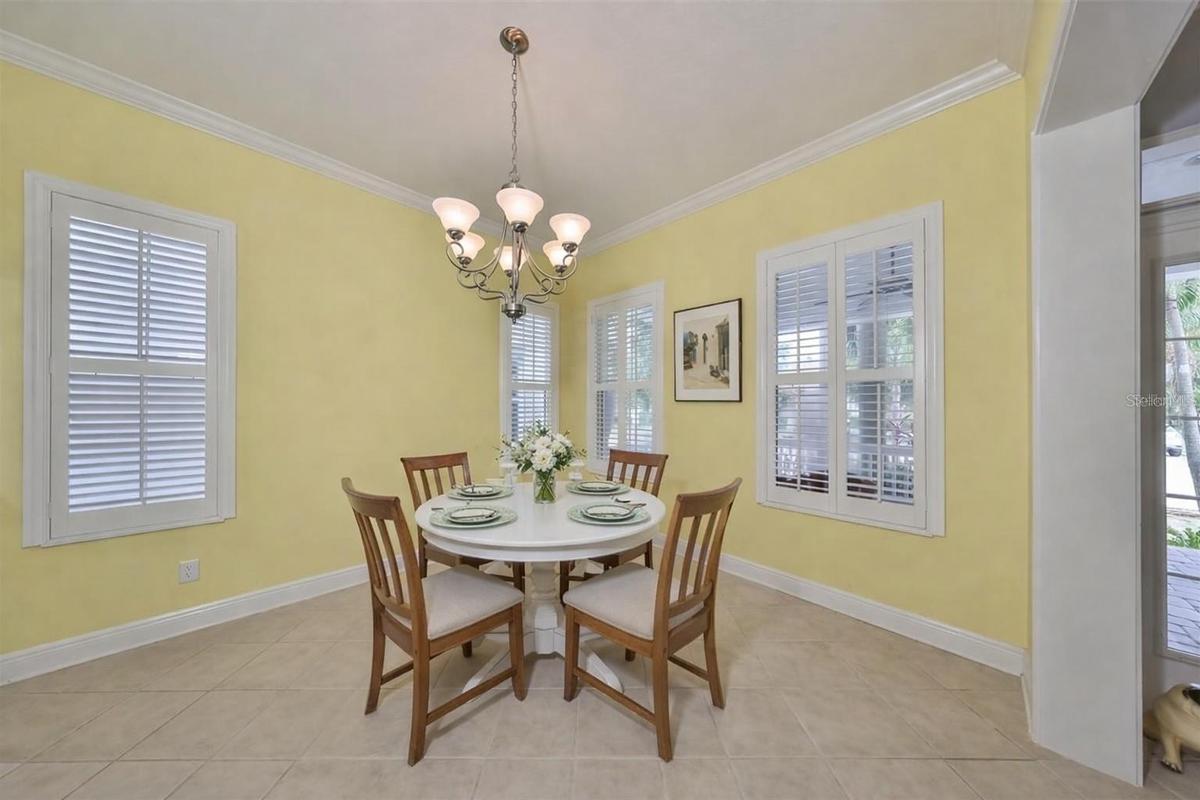 Dining room or formal living room adorned with windows.
