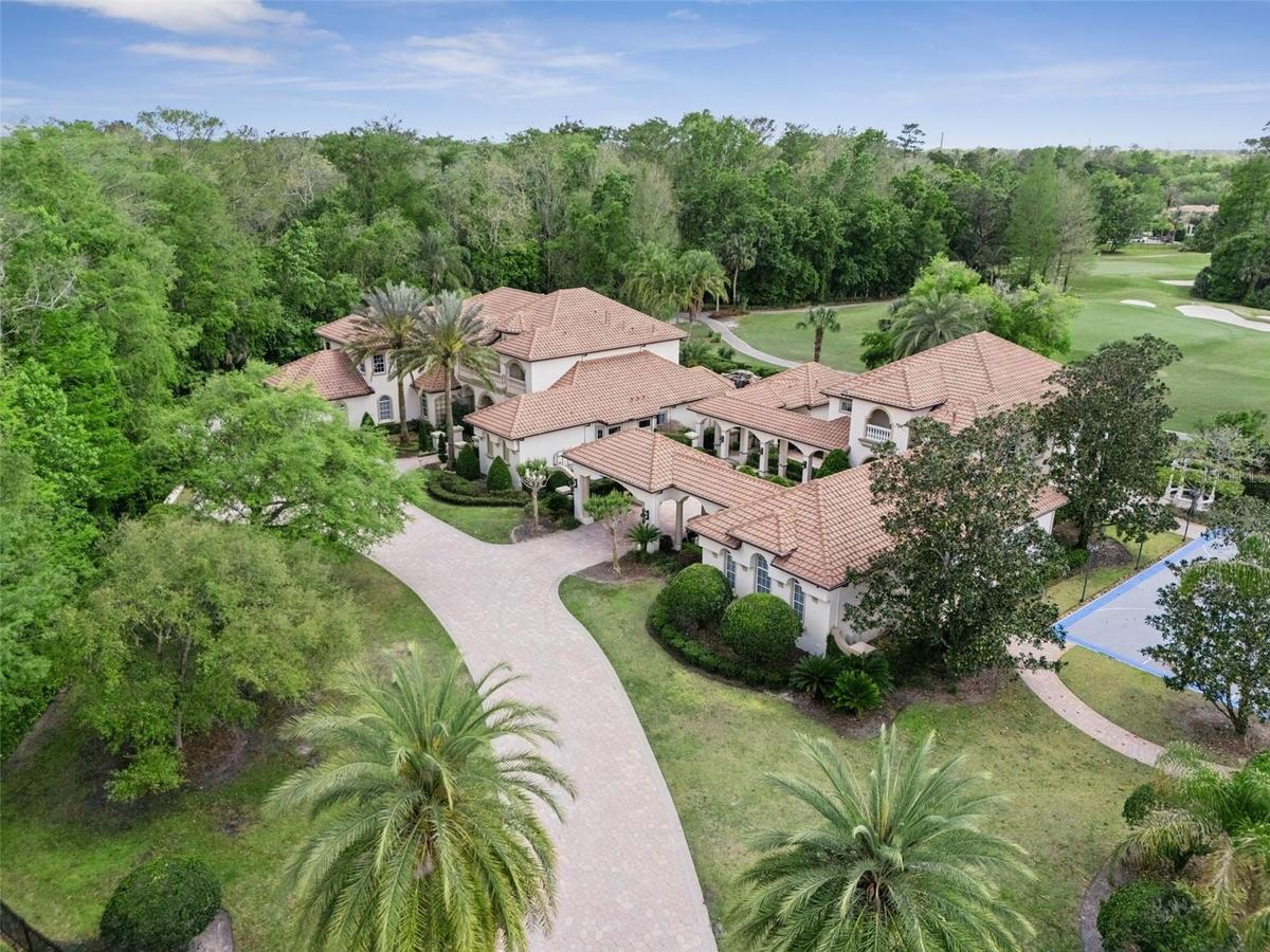 Welcome to your private compound with no neighbors on three sides, sited on 1.55 acres, gorgeous golf views of the 8th hole, separate 3100 sqft  guest
