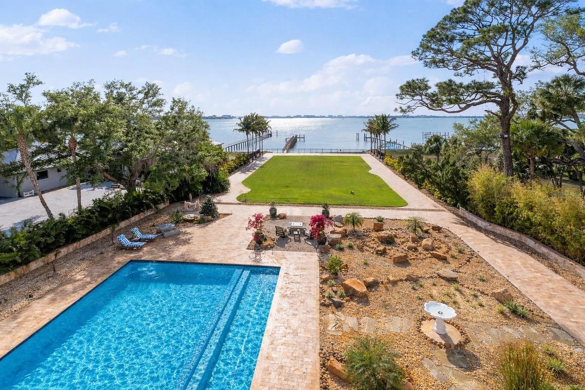 Resort-style pool and spa set within expansive, beautifully designed grounds.