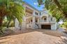 Grand estate façade with timeless architecture and expansive motor court.