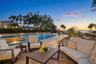 Resort-style pool and waterfront living with sunset views.