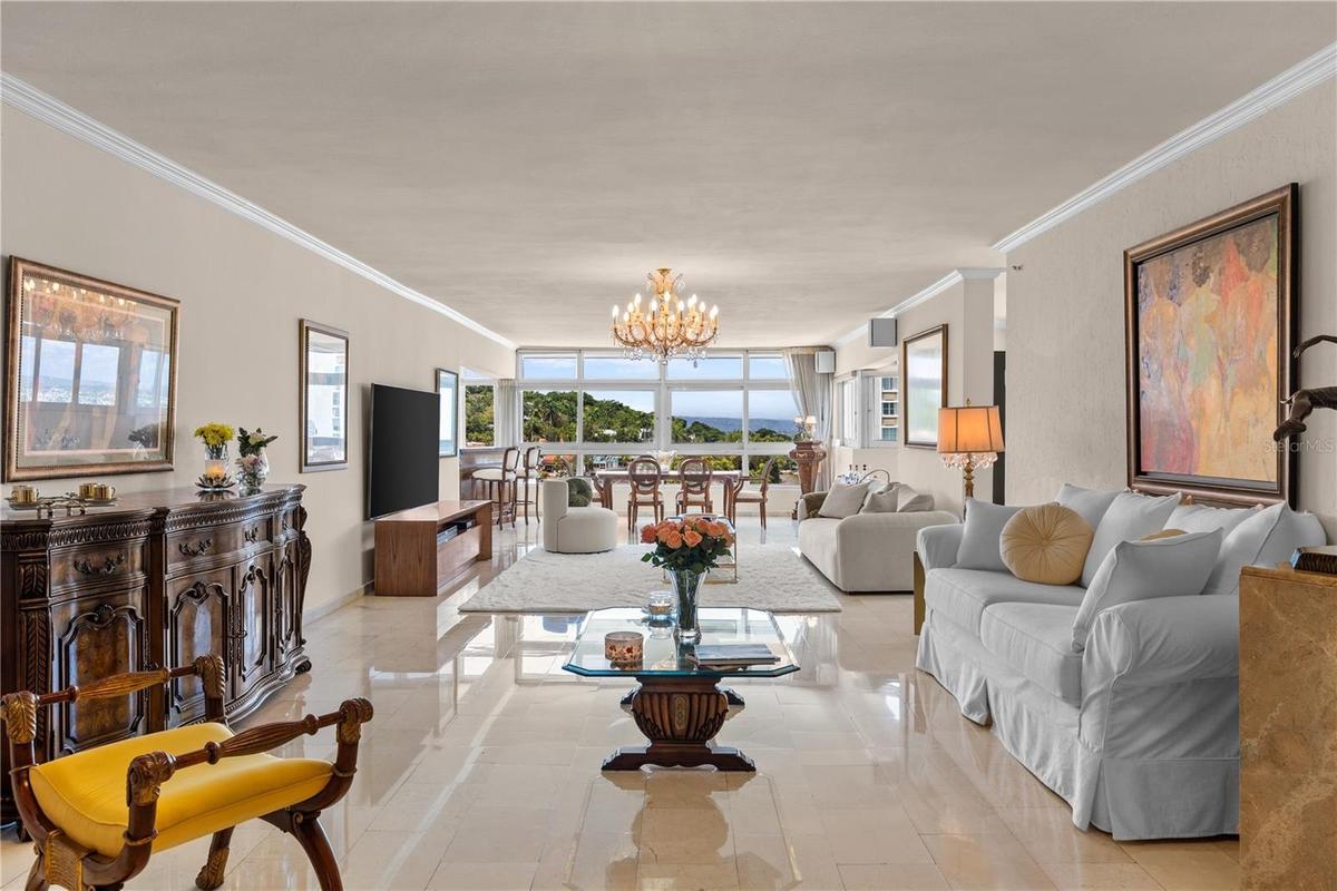 Step inside and you are welcomed by a vast, open living area with stunning mountain views to the west and , to the north, the historic charm of El Mor