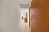 The primary bedroom was thoughtfully designed to feel completely private, with this hallway creating a quiet separation from the rest of the home. A t