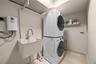 Spacious laundry room with new washer and dryer