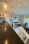 Charming porthole window adds a touch of Key West flair