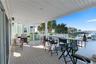Outdoor dining area with grill — ready for sunset dinners  Kitchen flows seamlessly to dining and outdoor entertaining areas