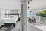Primary suite retreat with private waterfront balcony