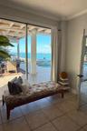 Bedroom 4 has waterfront views and pool access.