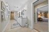 Primary bath with separate tub and shower. Double sinks and pocket doors. Radiant heated floors.