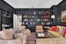 Cozy Library with beautiful built in cabinetry.