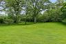 Open lawn with  border plantings