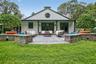 Outdoor bluestone terrace with a sitting wall. Off the kitchen and family room.
