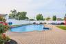 View of swimming pool with a fenced backyard and a patio area