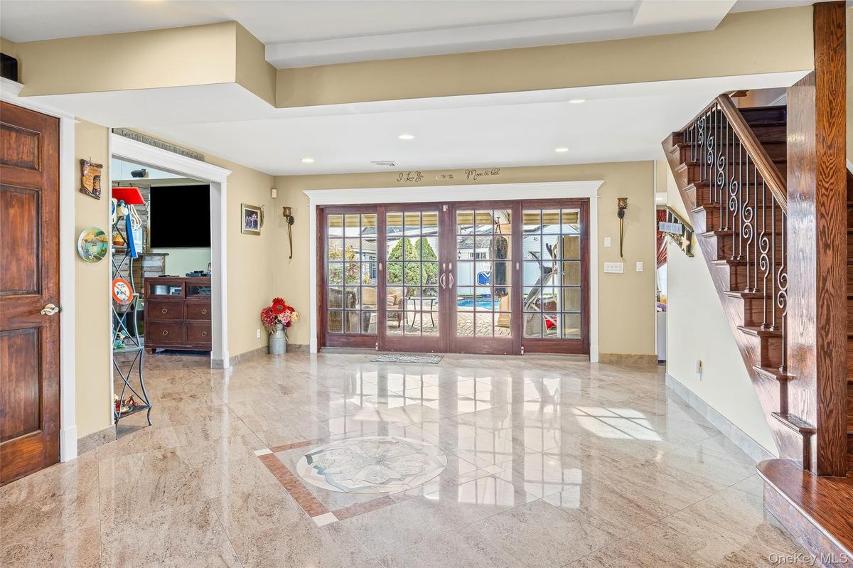 Building lobby with stairs and recessed lighting