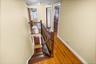 Staircase featuring wood-type flooring and baseboards