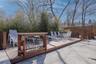 Step outside to a spacious deck surrounding the in-ground pool, creating the perfect outdoor oasis for relaxing, entertaining, and enjoying summer day