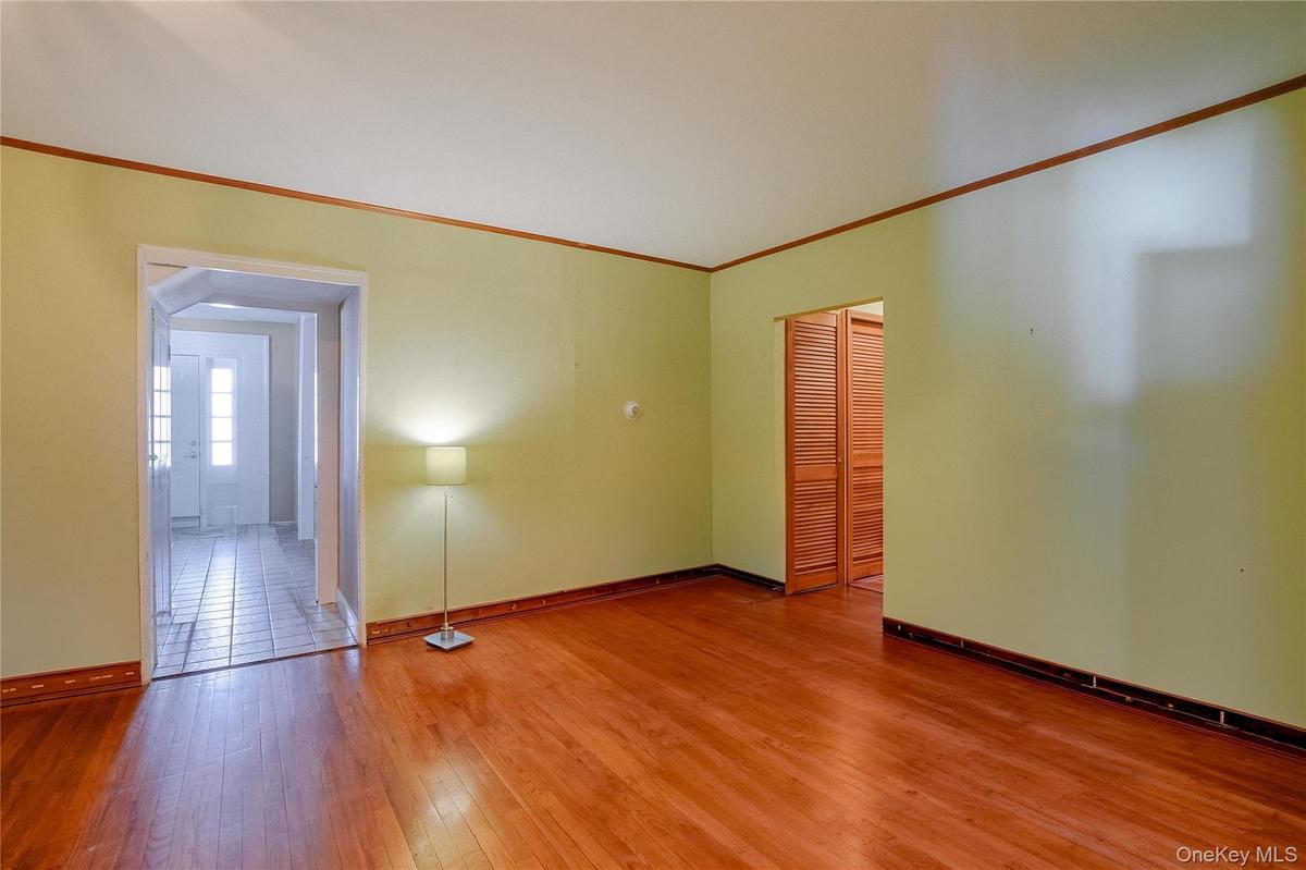The first-floor flex room features beautiful hardwood floors and endless possibilities—perfect as a home office, formal dining room, playroom, guest s