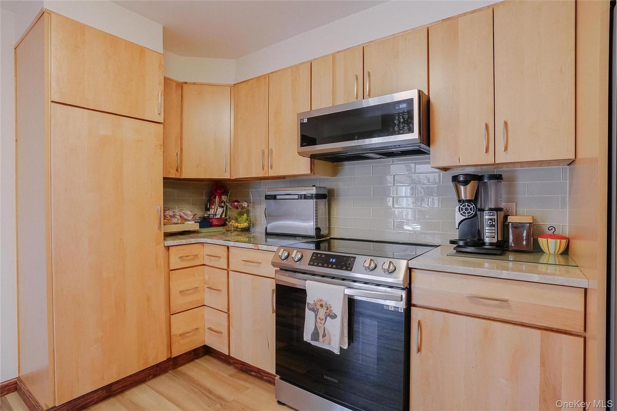With generous counter space for meal preparation, plenty of cabinetry for organization, and seamless flow into the surrounding living areas, this kitc