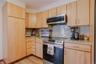 With generous counter space for meal preparation, plenty of cabinetry for organization, and seamless flow into the surrounding living areas, this kitc