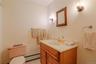 One of the two full bathrooms in the first-floor apartment is thoughtfully designed with a spacious layout, offering comfort, convenience, and functio