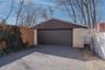 The spacious two-car detached garage offers plenty of room for parking, storage, and workspace, providing both convenience and functionality while com