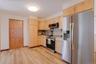 r. Rich wood floors bring warmth to the space, while the open layout makes the kitchen perfect for both everyday living and entertaining.