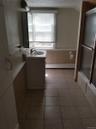 The second-floor full bathroom features a tub and shower combination, offering both comfort and convenience with a functional layout perfect for every