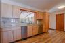 Natural light pours into the space, highlighting the craftsmanship and creating a bright, welcoming atmosphere. W