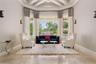 Formal Living Room overlooking the pool and sweeping golf views