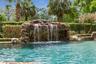 Waterfall with a grotto and built-in bench