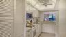 Laundry closet on the left