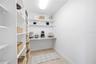 oversized walk in pantry with built in granite counter