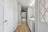Hallway to the laundry, storage and office