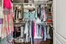 Primary walk-in closet with organzers