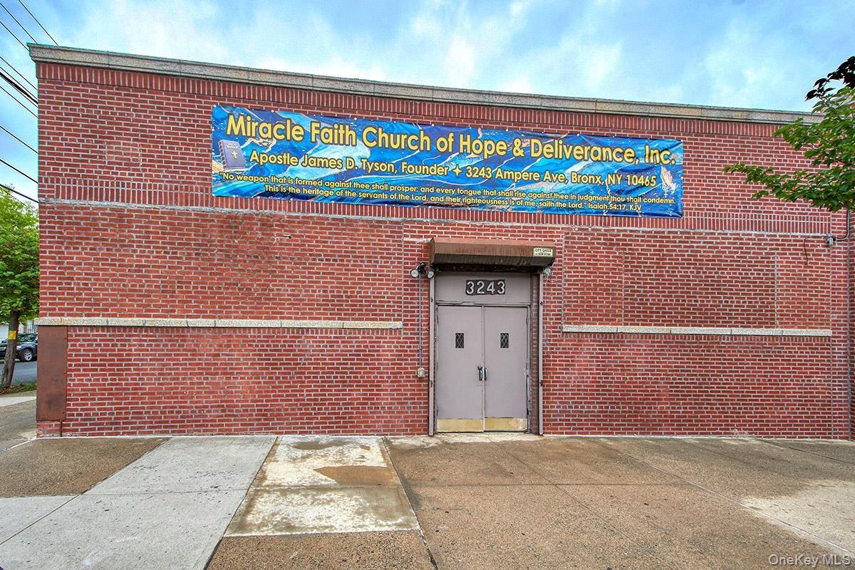 View of exterior entry featuring brick siding